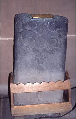 Medieval grave slab portion